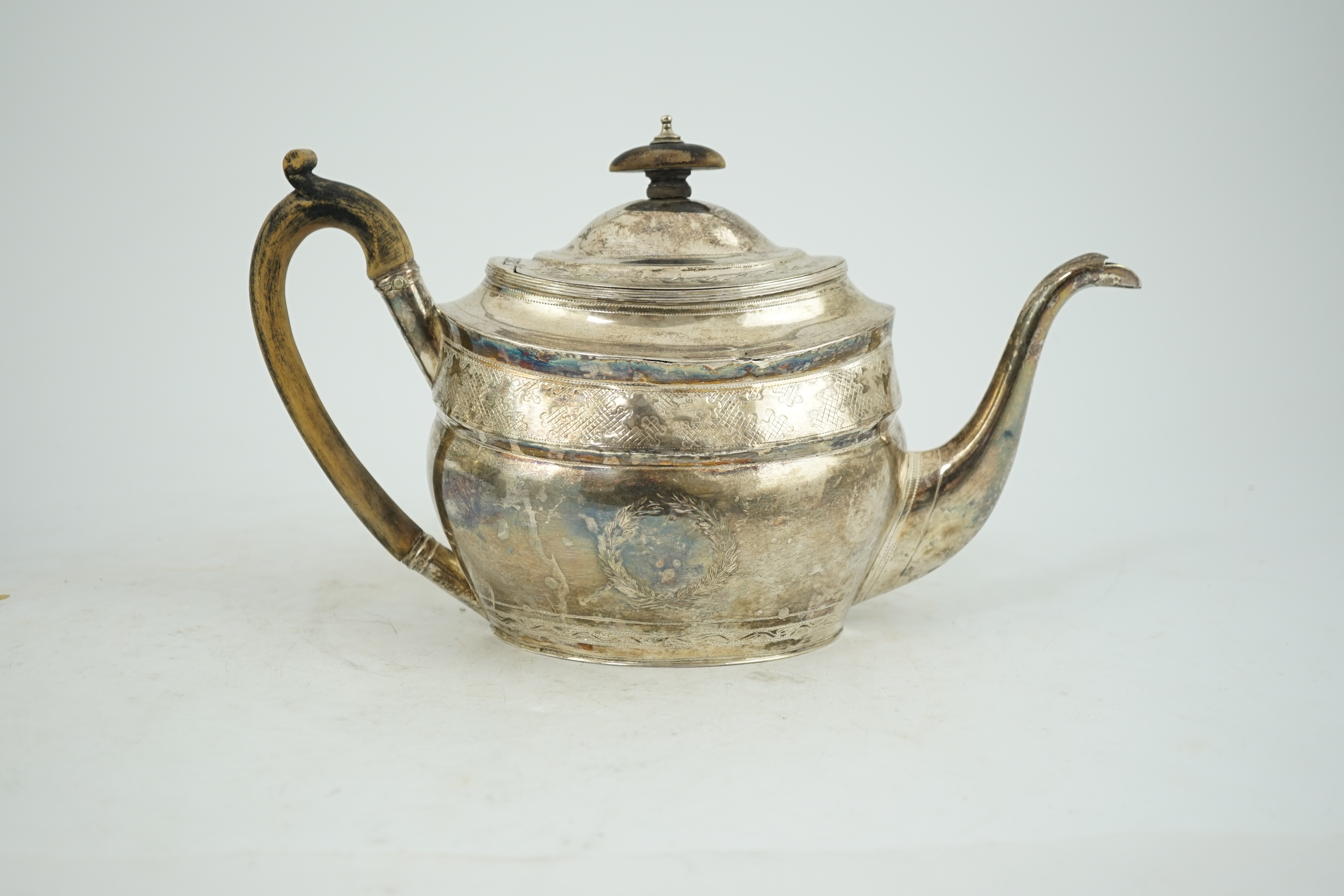 A George III engraved silver oval teapot, Alice & George Burrows, London, 1803, gross weight 13.2oz.